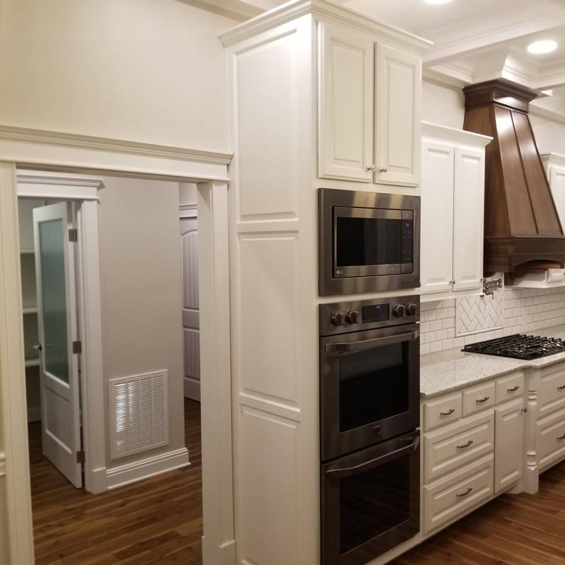 A picture containing indoor, wall, cabinet

Description automatically generated
