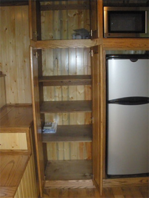 Pantry and appliance cabinet open