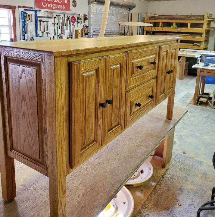 A wooden dresser in a room

Description automatically generated with medium confidence