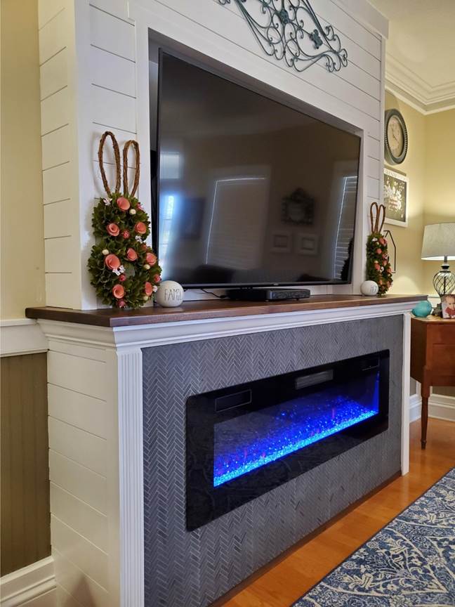 A fireplace in a room

Description automatically generated with medium confidence