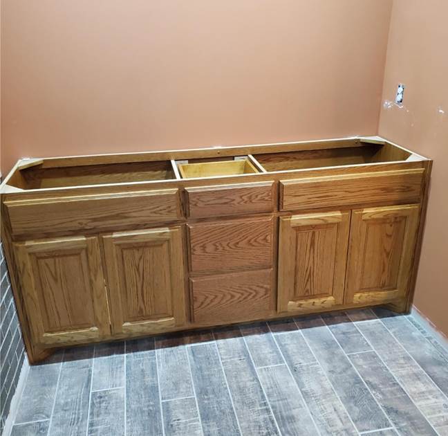 A wooden cabinet in a room

Description automatically generated with low confidence