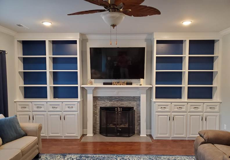A living room with a fireplace

Description automatically generated with medium confidence