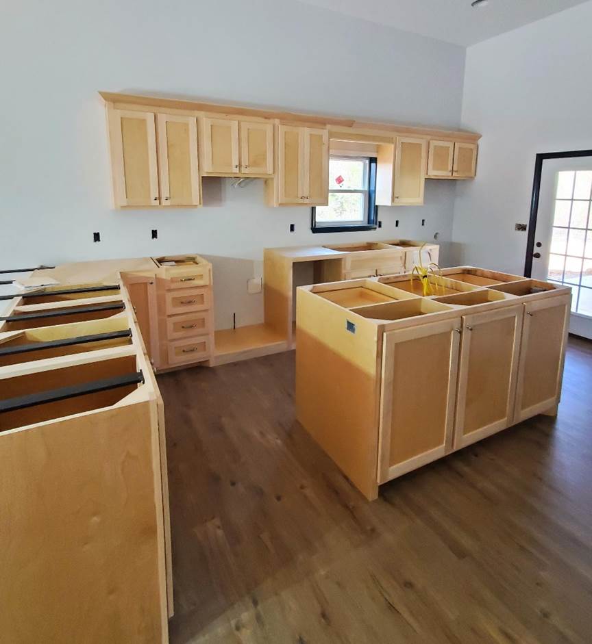 A kitchen with wooden cabinets

Description automatically generated with medium confidence