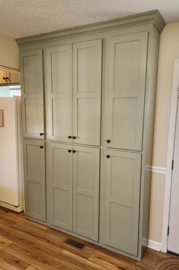 A large cabinet in a room

Description automatically generated