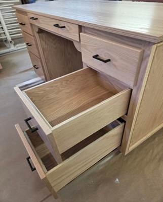 A close-up of a wooden drawer

AI-generated content may be incorrect.