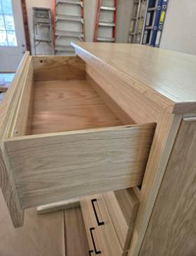 A wood shelf with a hole in the top

AI-generated content may be incorrect.
