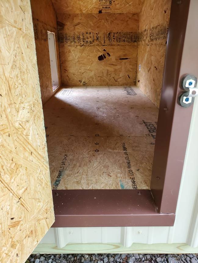 A picture containing indoor, building, sitting, floor

Description automatically generated