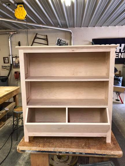 A large wooden shelf

Description automatically generated